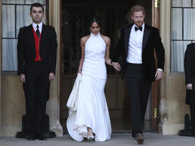 Meghan changed into a Stella McCartney dress for the intimate party of 200, while Prince Harry wore a tuxedo. Picture: AP)