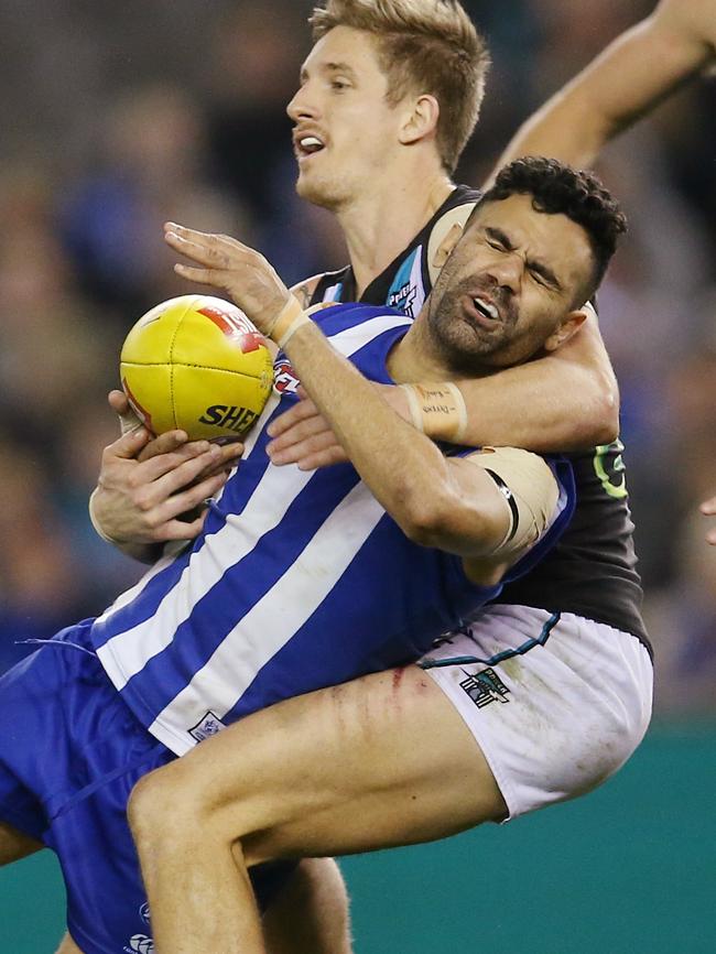 Hamish Harlett gives away a free kick for high contact against Lindsay Thomas. Picture: Michael Klein