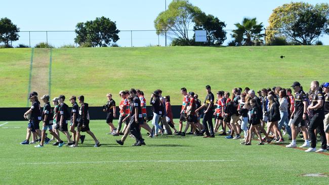 The crowd at Benjamin Hunter's memorial walking across the field at Sunshine Coast Stadium.