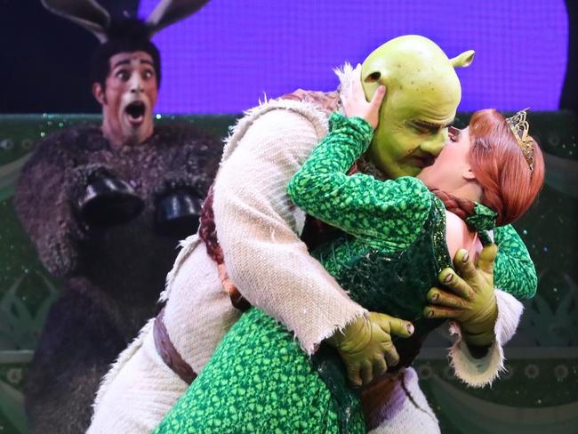 Lucy Durack as Princess Fiona, Ben Mingay as Shrek and Nat Jobe as Donkey during a media call for 'Shrek The Musical' at Her Majesty's Theatre in Melbourne, Wednesday, February 19, 2020. (AAP Image/David Crosling) NO ARCHIVING