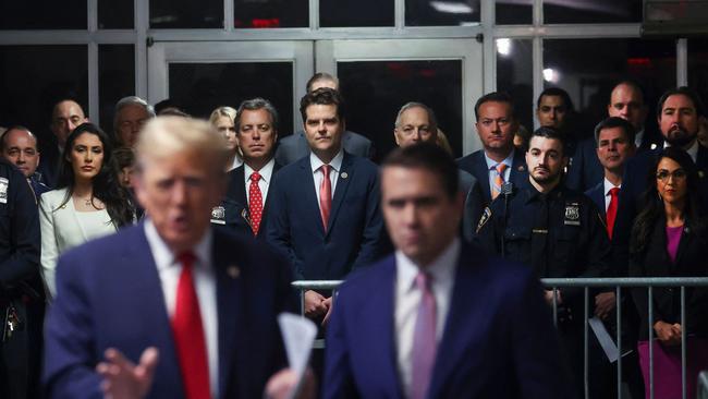 Anna Paulina Luna, Matt Gaetz, Andy Biggs and Lauren Boebert look on as former US President Donald Trump speaks to the press. Picture: AFP