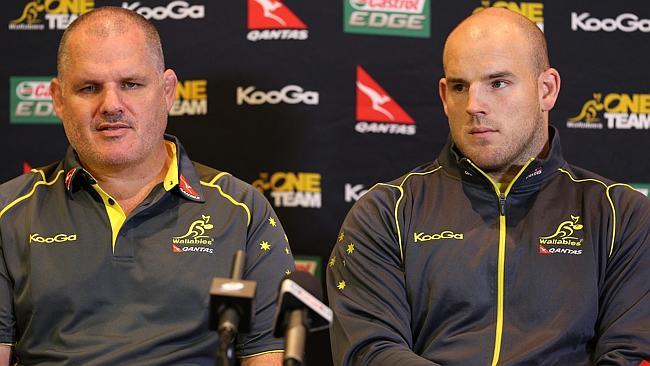 Wallabies coach Ewen McKenzie and Stephen Moore front the media last year.