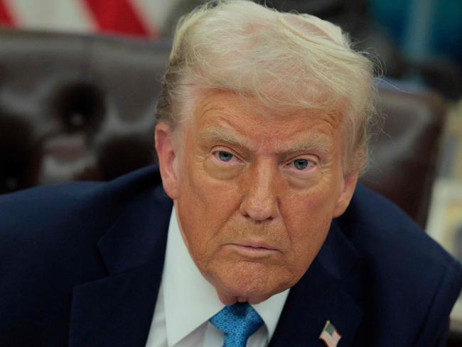 WASHINGTON, DC - JANUARY 31: U.S. President Donald Trump talks to reporters after signing an executive order, "Unleashing prosperity through deregulation," in the Oval Office on January 31, 2025 in Washington, DC. Trump spoke to reporters about tariffs against China, Canada and Mexico and how the newly confirmed Interior Secretary Doug Burghum will coordinate with the Energy Department and the Environmental Protection Agency.   Chip Somodevilla/Getty Images/AFP (Photo by CHIP SOMODEVILLA / GETTY IMAGES NORTH AMERICA / Getty Images via AFP)