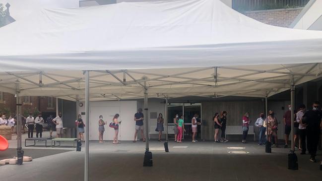 Voters had to queue for about 30 minutes on Friday afternoon at the St Matthew's Anglican Church Hall on The Corso at Manly to cast their pre-poll vote for the December 4 council election. Picture: Julie Cross