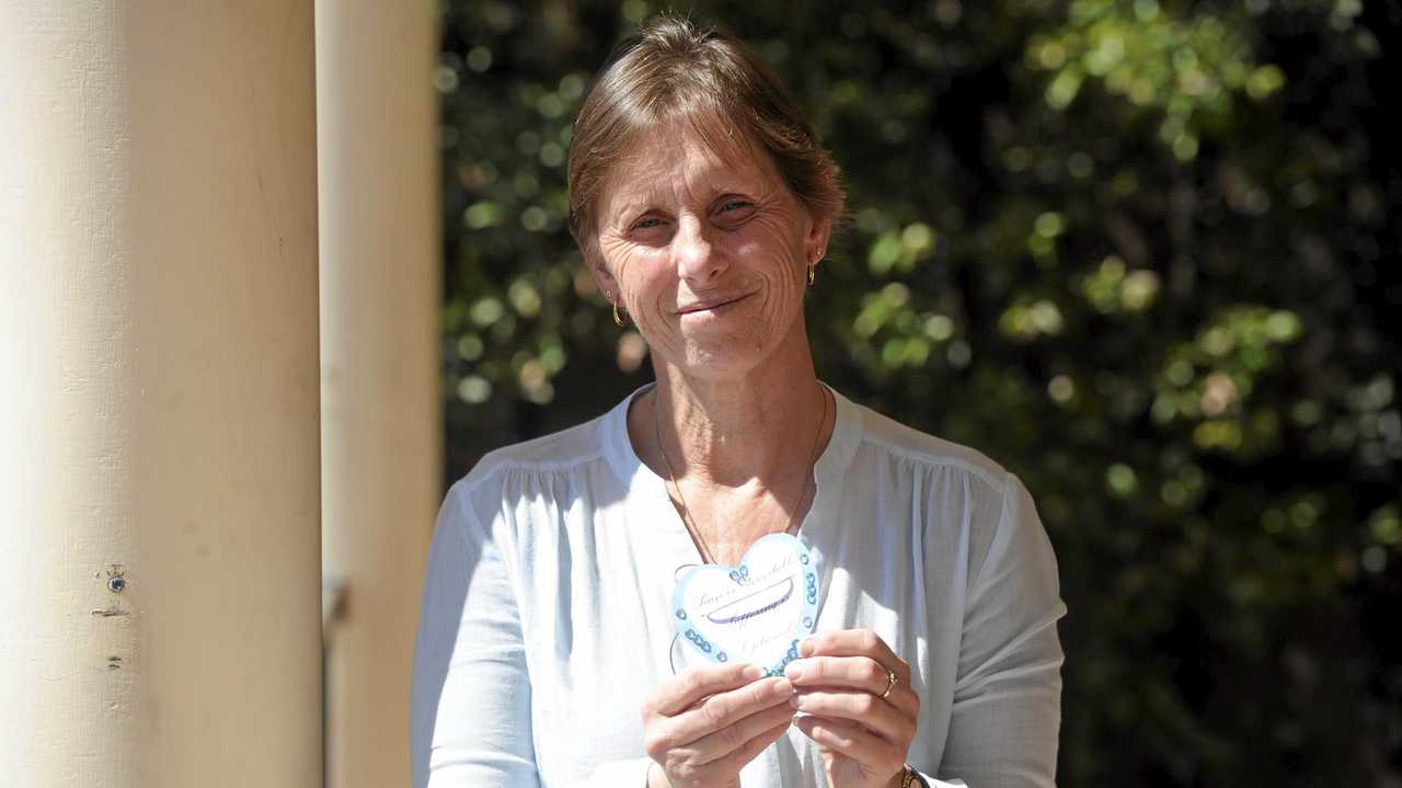 Michele Bowling with one of the blue hearts she is hoping people will wear to raise money and awareness for mental awareness on the anniversary of her son's death Daniel, who took his own life on November 30 2017. Picture: Jarrard Potter