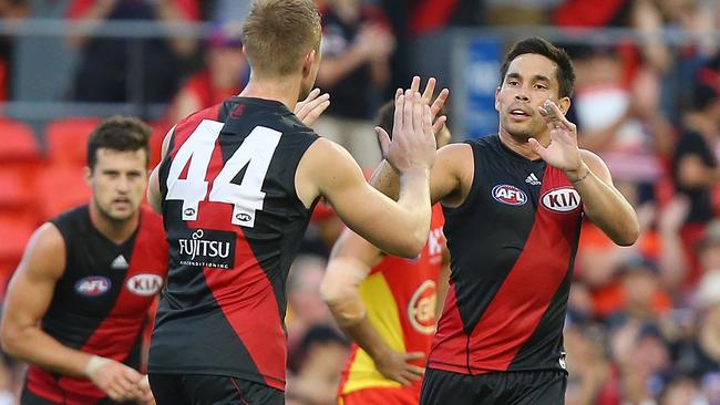 GOLD COAST, AUSTRALIA - MARCH 26: Matthew Stokes of the Bombers celebrates a goal during the round one AFL match between the Gold Coast Suns and the Essendon Bombers at Metricon Stadium on March 26, 2016 in Gold Coast, Australia. (Photo by Chris Hyde/Getty Images)