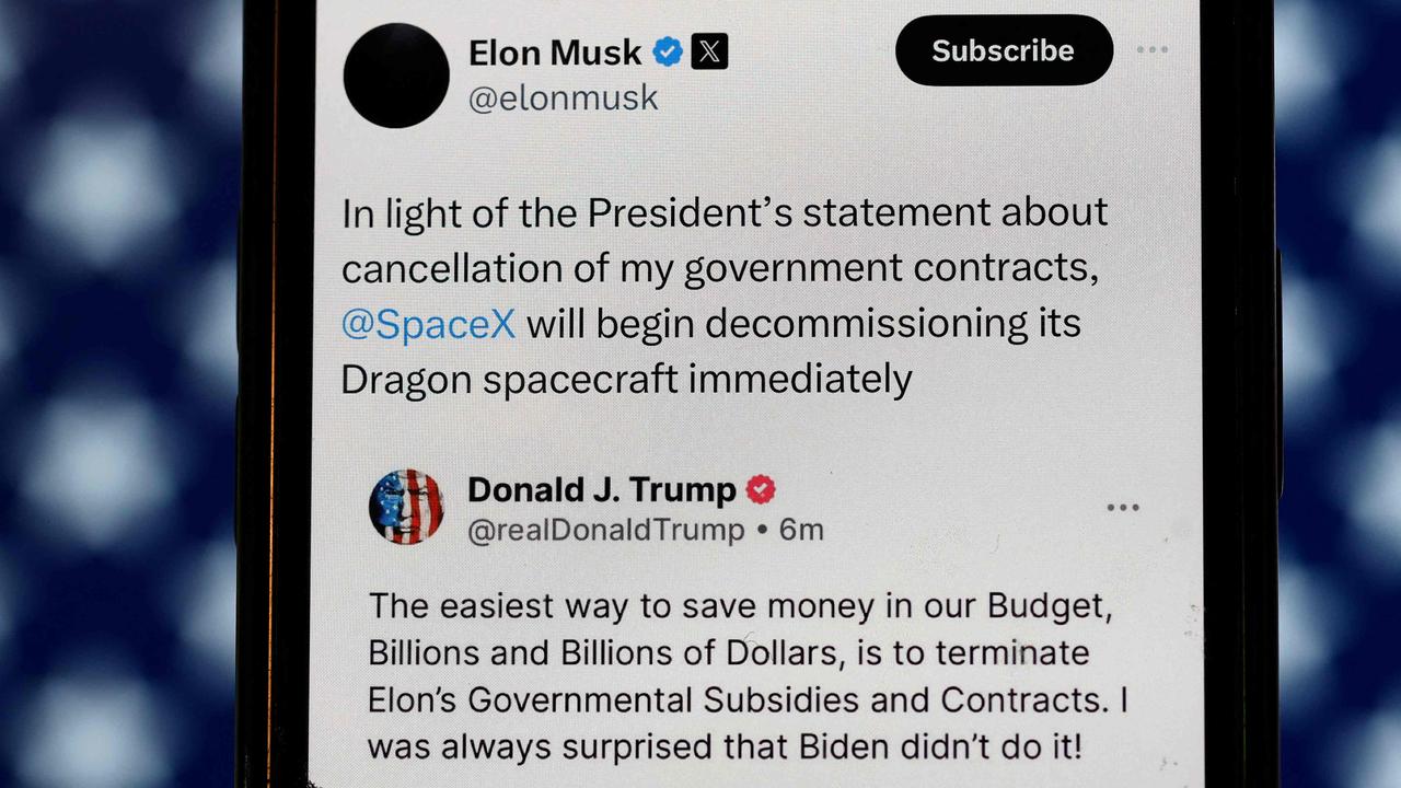 In this photo illustration, social media posts by U.S. President Donald Trump and Elon Musk are displayed on a smartphone on June 05, 2025 in San Anselmo, California. Photo: AFP