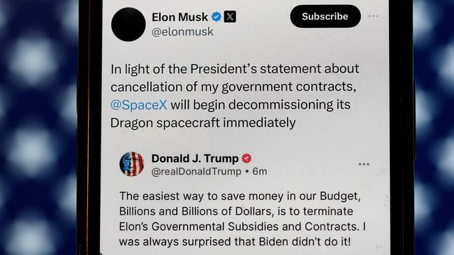 In this photo illustration, social media posts by U.S. President Donald Trump and Elon Musk are displayed on a smartphone on June 05, 2025 in San Anselmo, California. Photo: AFP