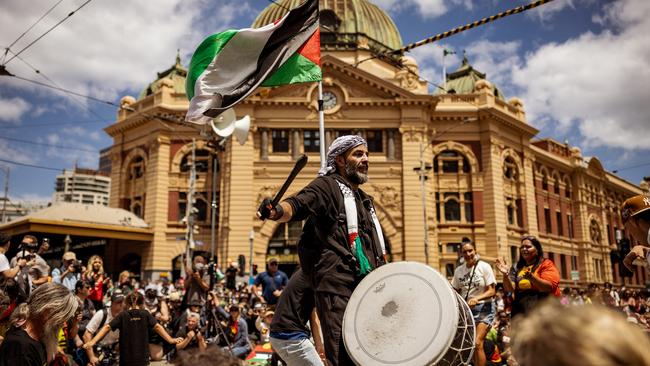 Palestinian men join Aboriginal people during an Australia Day protest in Melbourne. Picture: Getty Images