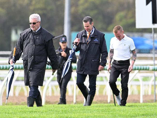 Stewards Paul Zimmerman (left) and Geoff Goold (middle) inspect the Sunshine Coast track with jockey Jim Byrne (right). Picture: Grant Peters - Trackside Photography