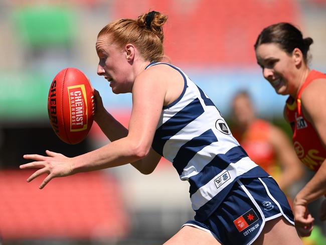 GOLD COAST, AUSTRALIA - SEPTEMBER 21: Aishling Moloney of the Cats runs with the ball during the round four AFLW match between Gold Coast Suns and Geelong Cats at People First Stadium, on September 21, 2024, in Gold Coast, Australia. (Photo by Matt Roberts/Getty Images)