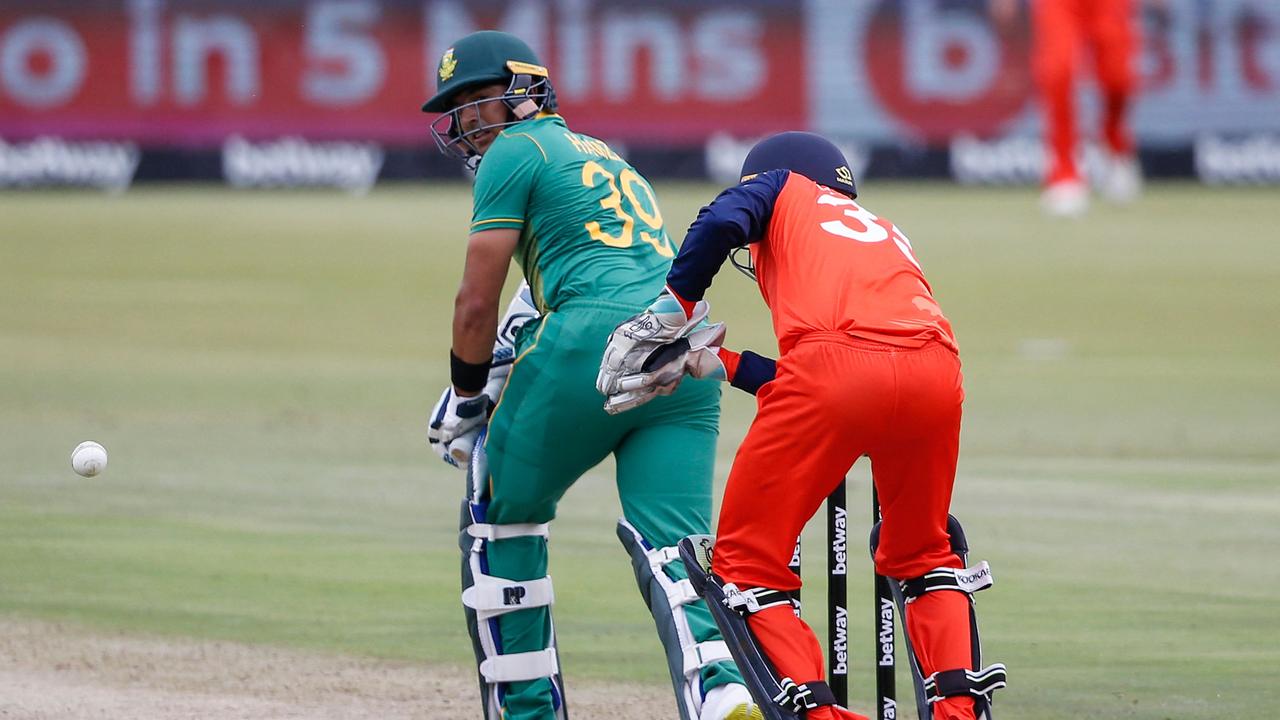South Africa's Zubayr Hamza (L) watches the ball after playing a shot.