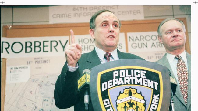 Rudolph Giuliani says in 1997 New York City appears to be leading the nation's fight against crime. City police commissioner Howard Safir is at right. Picture: AP