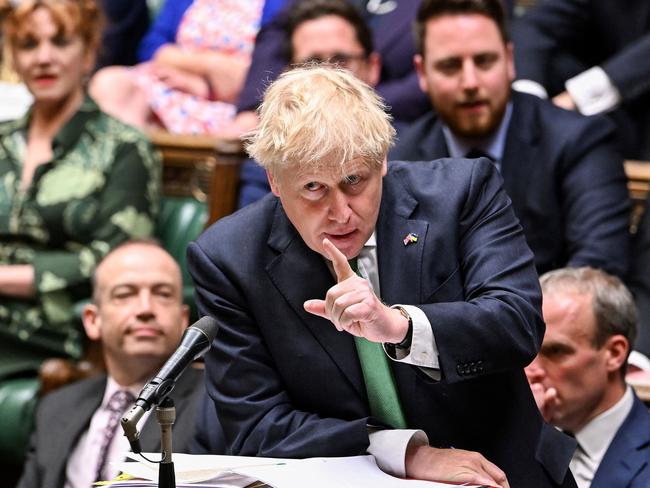 A handout photograph taken and released by the UK Parliament shows Britain's Prime Minister Boris Johnson attending the weekly Prime Minister's Questions (PMQs) session in the House of Commons, in London, on June 8, 2022. - Britain's Prime Minister Boris Johnson fought Wednesday to get back on the policy front foot, but was likened to a "Monty Python" character who refuses to admit he is mortally wounded. (Photo by JESSICA TAYLOR / UK PARLIAMENT / AFP) / RESTRICTED TO EDITORIAL USE - NO USE FOR ENTERTAINMENT, SATIRICAL, ADVERTISING PURPOSES - MANDATORY CREDIT " AFP PHOTO / Jessica Taylor /UK Parliament"