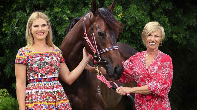 Gold Coast horse trainer Gillian and daughter Tayla Heinrich at their stables with horse Invinsible Tears. Picture: Adam Head