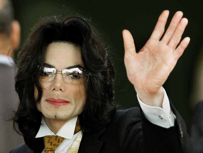 Michael Jackson waves as he arrives at the Santa Barbara County court house in Santa Maria, California, years ago when he faced sex abuse allegations. Picture: AFP