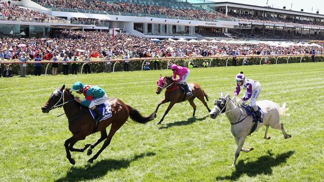 Luke Nolen guides Plucky Belle to victory on Melbourne Cup day at Flemington. Picture: Mark Dadswell