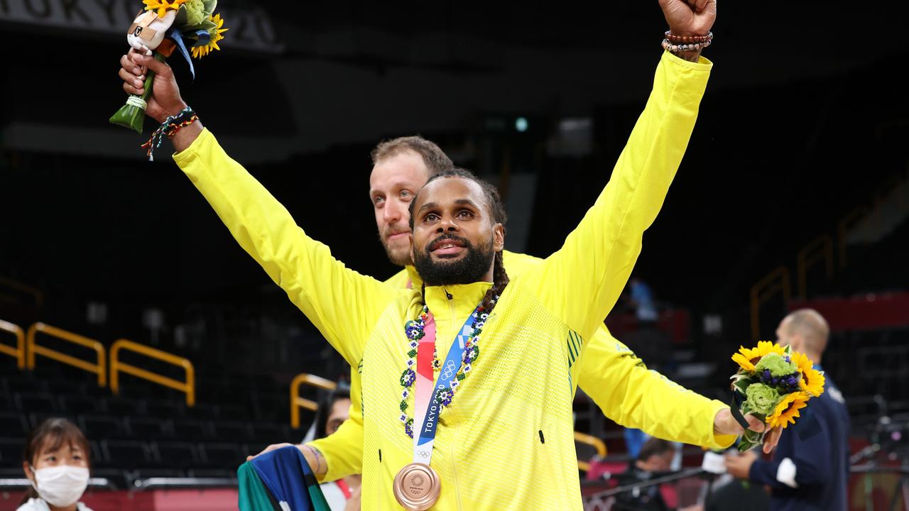 SAITAMA, JAPAN - AUGUST 07: Patty Mills of Team Australia celebrates with his bronze medal during the Men's Basketball medal ceremony on day fifteen of the Tokyo 2020 Olympic Games at Saitama Super Arena on August 07, 2021 in Saitama, Japan. (Photo by Kevin C. Cox/Getty Images)