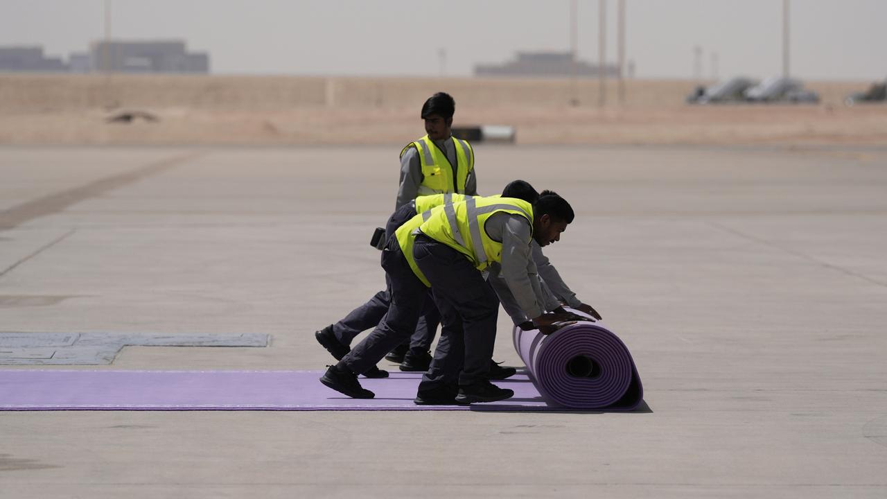 Workers rolled out the purple carpet in preparation for President Trump’s arrival. Picture: AP