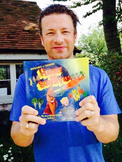 Celebrity chef Jamie Oliver with a copy of Novochenok-Serhan's first book. Picture: supplied