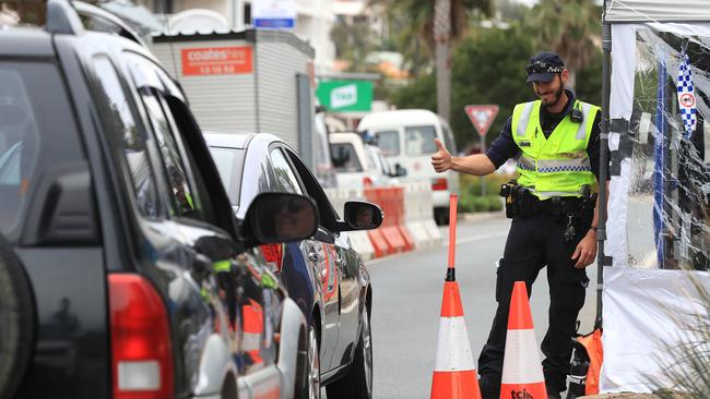 Police patrol the border at Dixon Street Coolangatta as Covid measures remain in place. Pics Adam Head