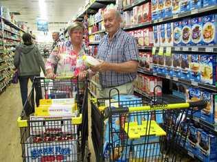 COUNTRY COMFORT: Marlene Owen and Tony Stewart stock up for their next delivery to drought-hit outback Queensland. Picture: Arthur Gorrie