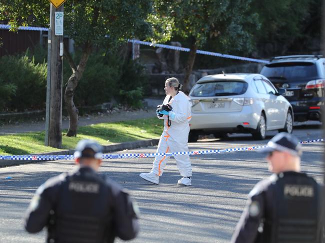 Forensic police at the scene on Monday morning. Picture: Max Mason-Hubers