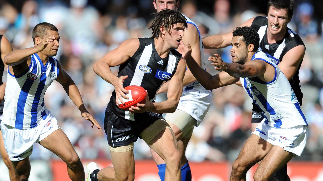 Collingwood v North Melbourne. Etihad Stadium. Scott Scott Pendlebury gets a clearance past Daniel Wells.