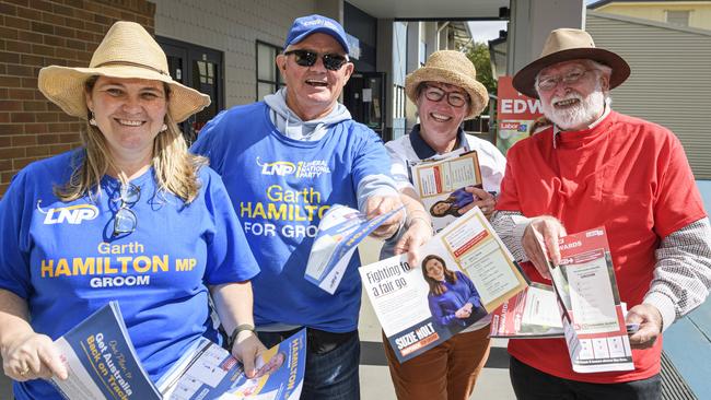 Volunteers (from left) Tammie Irons (LNP), Neil Munro (LNP), Roslyn Hooper (Holt) and Leon Surawski (Labor) at St Joseph's College on polling day in Groom, Saturday, May 3, 2025. Picture: Kevin Farmer