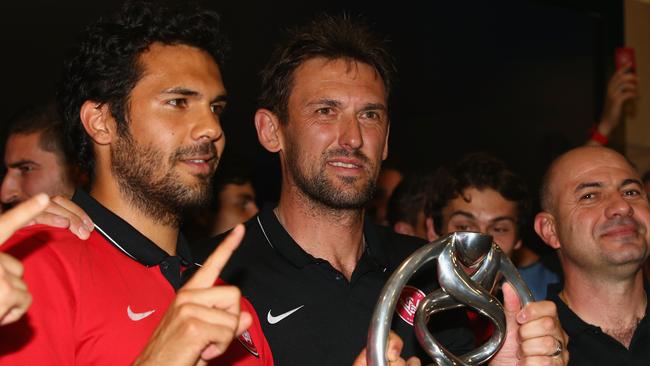 Nikolai Topor-Stanley and Tony Popovic pose with the Asian Champions League trophy.