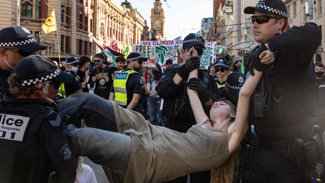 Police moved in and arrested Extinction Rebellion activists after they disrupted the Flinders Street Station intersection. Picture: NCA NewsWire / Diego Fedele