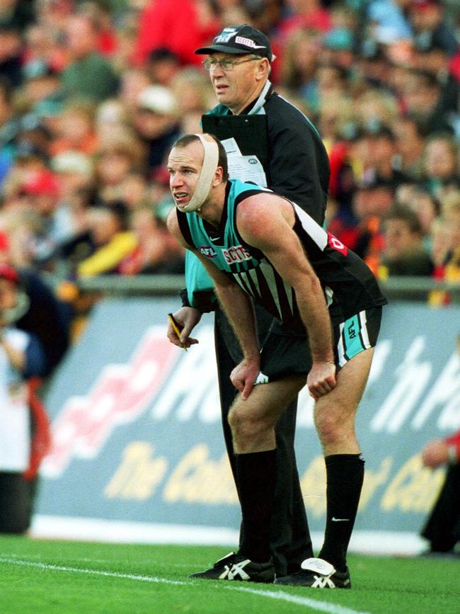 Power’s Josh Francou wearing tape around his head in Showdown XII at AAMI Stadium in 2002.