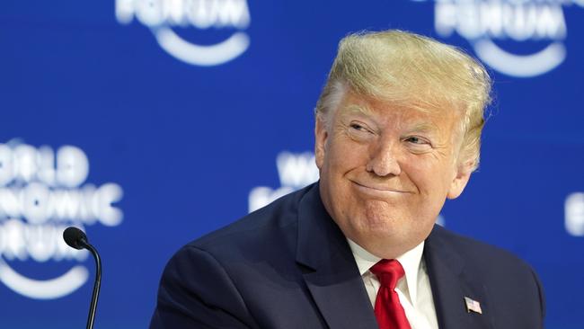 ‘We must reject the perennial prophets of doom’ ... Donald Trump before speaking at the World Economic Forum in Davos, Switzerland, on Tuesday night. Picture: AP