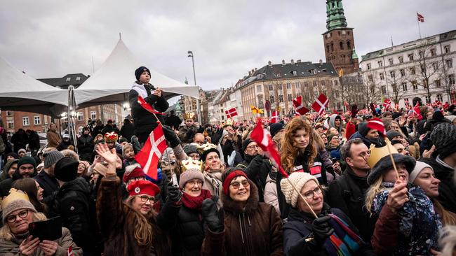 People celebrate the declaration on the accession to the throne of King Frederik X of Denmark and Queen Mary of Denmark at the Christiansborg Palace Square in Copenhagen, Denmark on January 14, 2024. Picture: Emil Nicolai Helms / Ritzau Scanpix / AFP