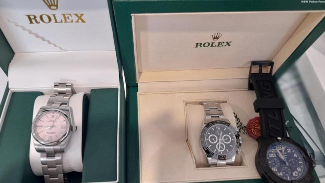 Police seized Rolex watches while arresting two men charged with embezzling $1.4m from the NSW Department of Education. Picture: NSW Police