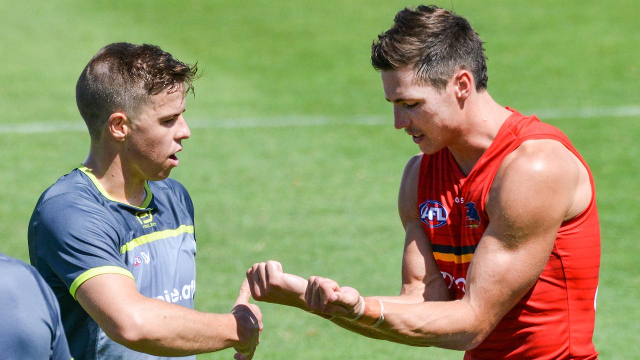 Jake Kelly discusses a tackle with an AFL umpire during the Crows’ intra-club match on Saturday. Picture: Brenton Edwards