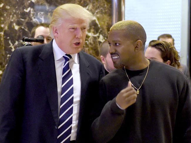 (FILES) In this file photo taken on December 13, 2016, singer Kanye West and President-elect Donald Trump arrive to speak with the press after their meetings at Trump Tower in New York. - The rapper and fashion designer Kanye West has suggested he will run for president and wants Donald Trump to be his running mate. Trump, for his part, brushed aside a recent meeting with West as of no significance. The artist, who goes by the name Ye, posted on November 24, 2022, a swirling symbol on his Twitter account with "Ye" and the number 24, apparently representing 2024, the year of the next US presidential election. (Photo by TIMOTHY A. CLARY / AFP)