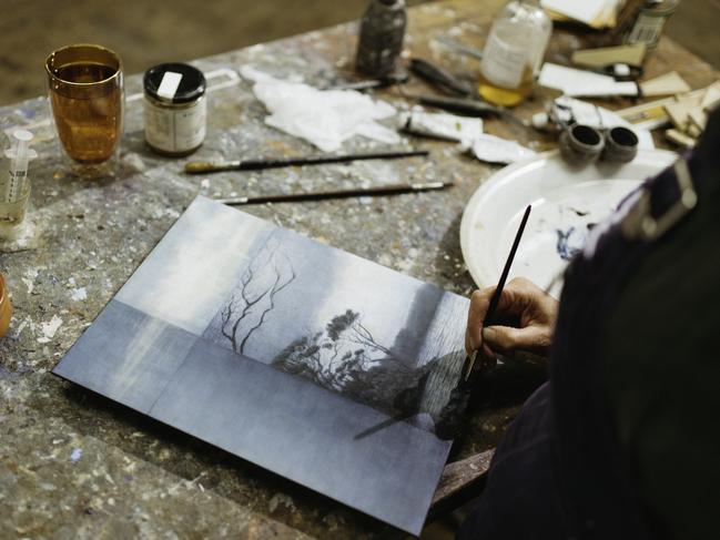 Tasmanian artist Michaye Boulter at work on one of her latest pieces in her Salamanca studio. Picture: Richard Harmey