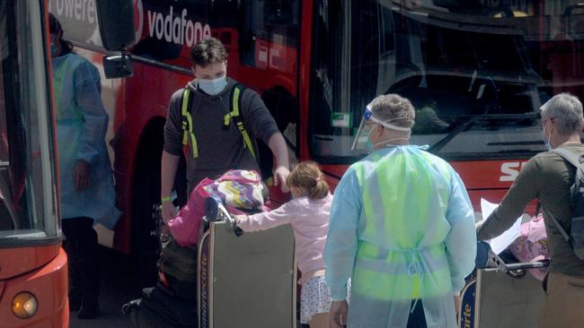 Passengers prepare to board buses after touching down in Melbourne. Picture: Andrew Henshaw