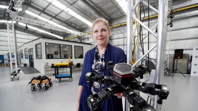 Dr Sue Keay with Gizmo the CSIRO Hexapod in the new Robotics Innovation Centre at Queensland Centre for Advanced Technologies. Pics Tara Croser.