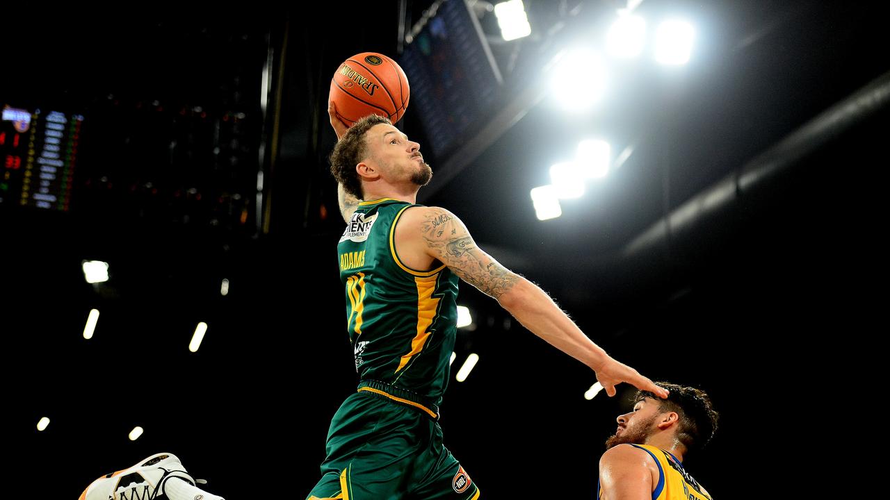 Josh Adams of the Jackjumpers slam dunks during the NBL Blitz match between Tasmania Jackjumpers and Brisbane Bullets.