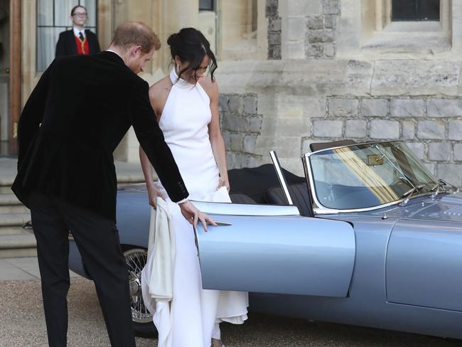 Prince Harry drove the couple to the evening reception at Frogmore House, hosted by the Prince of Wales. Picture: AP