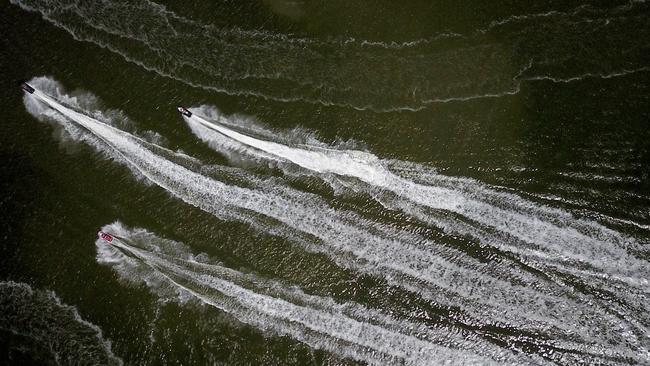 Jetski riders on the Georges River at Revesby Beach. Picture: Jonathan Ng