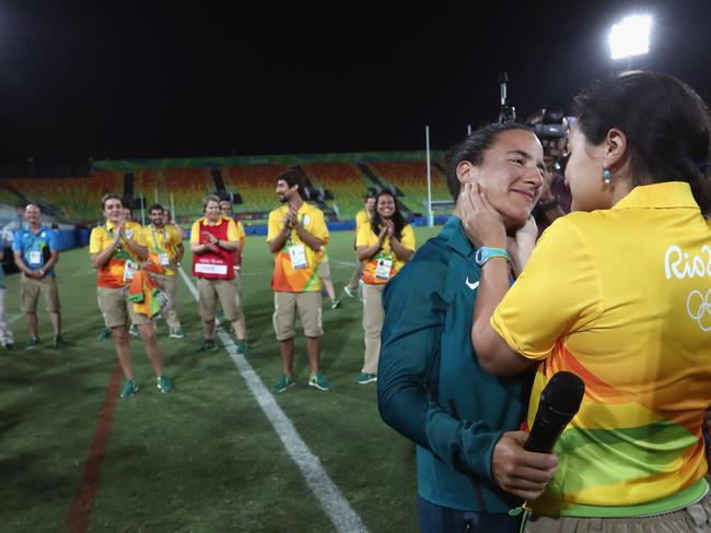 They got engaged on the Rugby Sevens’ Olympic field, in front of team mates and volunteers. Picture: Alexander Hassenstein/Getty Images