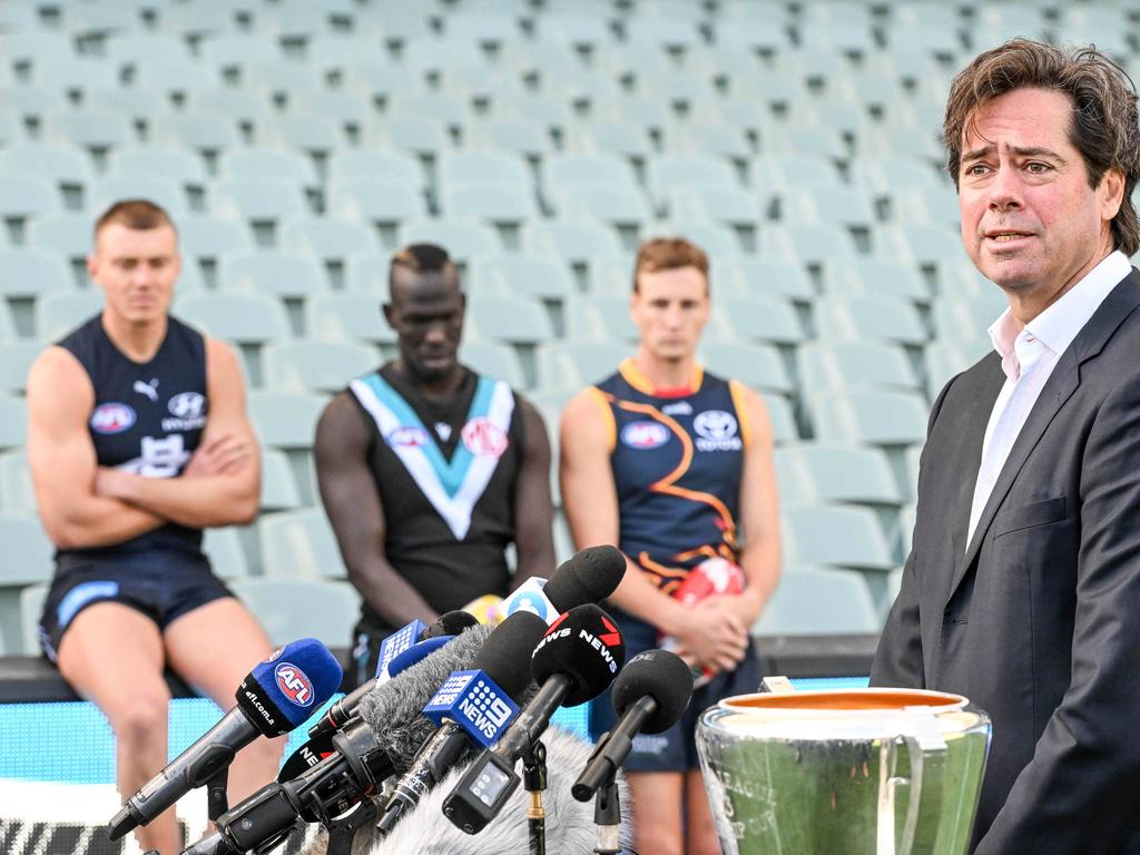 ADELAIDE, AUSTRALIA - NewsWire Photos APRIL 12, 2023: Carlton captain Patrick Cripps, Port Adelaide player Aliir Aliir and Adelaide Crows captain Jordan Dawson watch AFL CEO Gillon McLachlan at Adelaide Oval in the lead up to Gather Round Picture: NCA NewsWire / Brenton Edwards