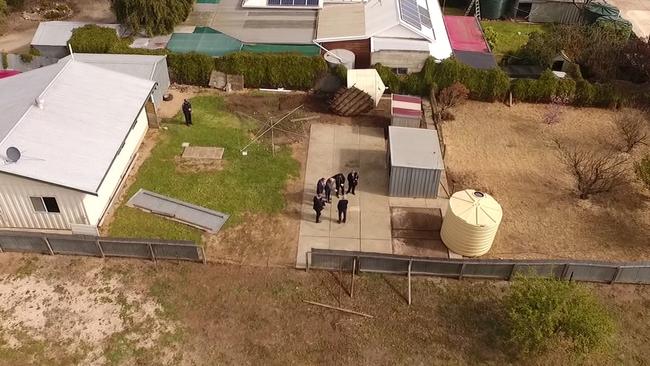 Geoffrey Adams with police at their former Maitland home. Picture: 9 News