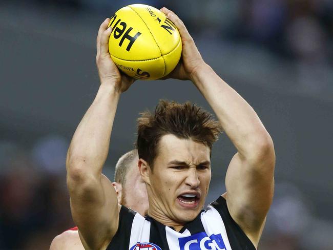 Kyle Martin marks during the 3rd quarter of the Melbourne v Collingwood match at the MCG.