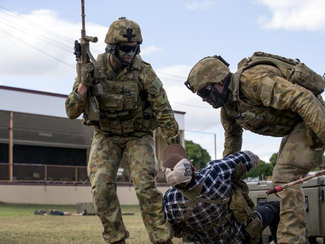 Australian Army Staff Cadets drag a wounded enemy to cover in a simulated section attack during Exercise Binh Ba 19. Exercise Binh Ba is the final exercise for Royal Military College Duntroon officer cadets prior to their graduation. The activities are designed to incorporate the complexities of realistic physical, human, environmental and information terrain, providing trainees with developmental steps to becoming effective leaders in the Australian Army. In 2019 Exercise Binh Ba was conducted at Charters Towers, Queensland, from May 16-27. On the first Sunday of the exercise the Australian Army held a community open day at the Charters Towers Showgrounds to showcase some of the vehicles, tactics and technology the Royal Military College Duntroon utilise during training.