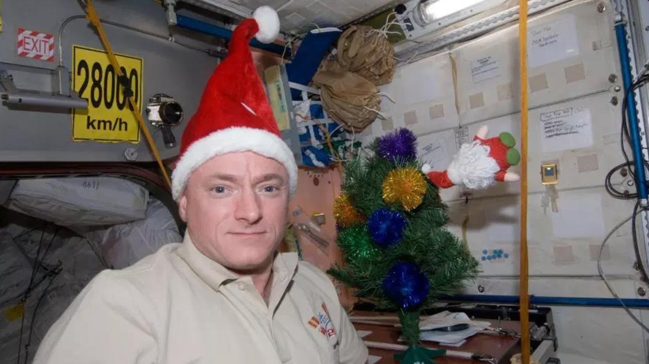 Christmas in space sees astronauts in Santa hats and decorating the ISS. Note the Santa floating next to the Christmas tree. Picture: CC