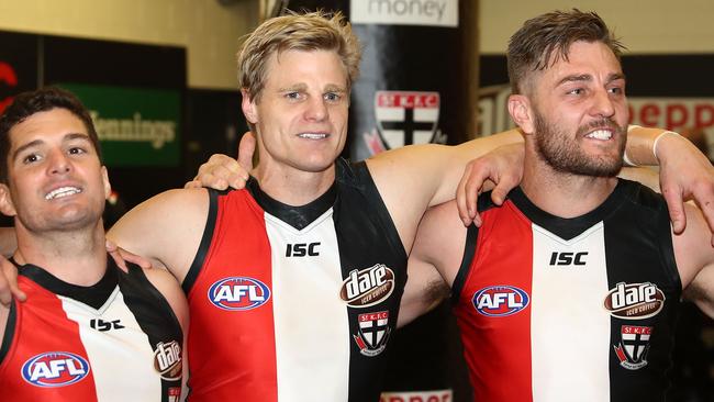 Sam Fisher with teammates Leigh Montagna and Nick Riewoldt. Picture: Getty Images